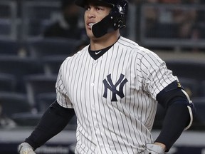 New York Yankees' Giancarlo Stanton reacts after striking out against the Miami Marlins during the eighth inning of a baseball game Tuesday, April 17, 2018, in New York.