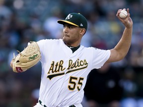 Oakland Athletics starting pitcher Sean Manaea throws to a Boston Red Sox batter during the first inning of a baseball game in Oakland, Calif., Saturday, April 21, 2018.