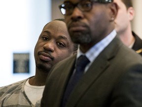Cornell Beckley, left, listens to Common Pleas Judge Steven Martin, during his arraignment at the Hamilton County Courthouse Tuesday, April 24, 2018. Beckley is scheduled to stand trial next month in connection with the mass shooting at the Cameo nightclub. Beckley, 28, has been accused of paying off witnesses. Court documents say Justin Watson is involved in two of the alleged bribery incidents.