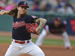 Cleveland Indians starting pitcher Mike Clevinger delivers in the first inning of the team's baseball game against the Toronto Blue Jays, Friday, April 13, 2018, in Cleveland.