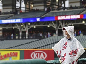 Jake Hofstetter stands during a rain delay in a baseball game between the Cleveland Indians and the Toronto Blue Jays, Saturday, April 14, 2018, in Cleveland.