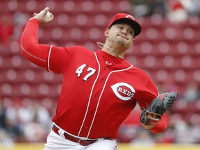 Cincinnati Reds starting pitcher Sal Romano throws in the first inning of a baseball game against the Washington Nationals, Sunday, April 1, 2018, in Cincinnati.