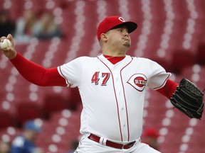 Cincinnati Reds starting pitcher Sal Romano throws in the first inning of a baseball game against the Atlanta Braves, Monday, April 23, 2018, in Cincinnati.