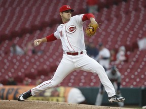 Cincinnati Reds starting pitcher Tyler Mahle throws during the first inning of the team's baseball game against the Atlanta Braves, Tuesday, April 24, 2018, in Cincinnati.