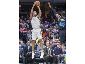 Cleveland Cavaliers' Rodney Hood (1) shoots over Dallas Mavericks' Harrison Barnes (40) during the first half of an NBA basketball game in Cleveland, Sunday, April 1, 2018.