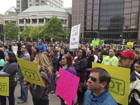 FILE – In this May 9, 2017, file photo, hundreds of supporters of Ohio's largest online charter school, the Electronic Classroom of Tomorrow or ECOT, participate in a rally outside the Statehouse in Columbus, Ohio. Education regulators are reviewing a whistleblower's claim that the online charter school, which abruptly closed in Jan. 2018, inflated attendance figures tied to its state funding, The Associated Press has learned, using software purchased after previous allegations of attendance inflation.