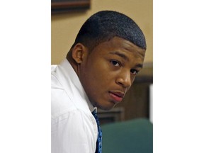 FILE – In this March 15, 2013, file photo, Ma'lik Richmond sits in court before the start of the third day of his trial on rape charges with co-defendant Trent Mays in juvenile court in Steubenville, Ohio. An Ohio judge has scheduled a Thursday, April 19, 2018, hearing about whether Richmond, a high school and college football player convicted as a juvenile of raping a 16-year-old girl during an alcohol-fueled party, should be removed from the state's sex offender listings.