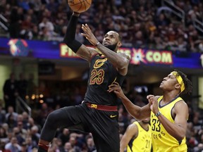 Cleveland Cavaliers' LeBron James (23) drives to the basket against Indiana Pacers' Myles Turner (33) during the first half of Game 2 of an NBA basketball first-round playoff series, Wednesday, April 18, 2018, in Cleveland.