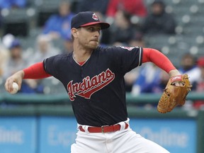 Cleveland Indians starting pitcher Josh Tomlin delivers in the first inning of a baseball game against the Chicago Cubs, Tuesday, April 24, 2018, in Cleveland.