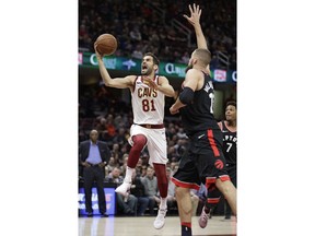 Cleveland Cavaliers' Jose Calderon (81) drives to the basket against Toronto Raptors' Jonas Valanciunas (17) during the first half of an NBA basketball game Tuesday, April 3, 2018, in Cleveland.