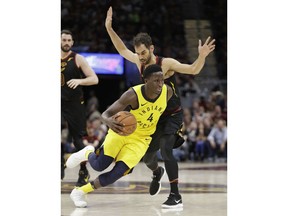 Indiana Pacers' Victor Oladipo (4) drive past Cleveland Cavaliers' Jose Calderon (81), from Spain, in the second half of Game 5 of an NBA basketball first-round playoff series, Wednesday, April 25, 2018, in Cleveland. The Cavaliers won 98-95.