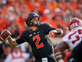 FILE - In this Nov. 4, 2017, file photo, Oklahoma State quarterback Mason Rudolph (2) attempts a pass during an NCAA football game against Oklahoma in Stillwater, Okla. Rudolph is expected to be taken in the NFL Draft.