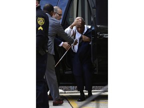 Bill Cosby arrives for his sexual assault trial, nearly stumbling out of the SUV he arrived in, at the Montgomery County Courthouse, Thursday, April 5, 2018, in Norristown, Pa.