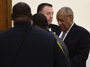 Bill Cosby, right, arrives for his sexual assault trial at courtroom A at the Montgomery County Courthouse, Wednesday, April 18, 2018, in Norristown, Pa.