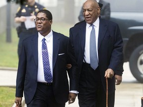 Bill Cosby, right, arrives for his sexual assault case with spokesperson Andrew Wyatt, left, at the Montgomery County Courthouse, Wednesday, April 4, 2018, in Norristown.
