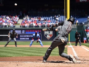 Arizona Diamondbacks' Nick Ahmed hits a three-run home run off Philadelphia Phillies' Ben Lively during the third inning of a baseball game, Thursday, April 26, 2018, in Philadelphia.