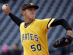 Pittsburgh Pirates starting pitcher Jameson Taillon delivers in the first inning of a baseball game against the Cincinnati Reds in Pittsburgh, Sunday, April 8, 2018.