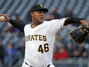 Pittsburgh Pirates starting pitcher Ivan Nova winds up during the first inning of the team's baseball game against the Minnesota Twins in Pittsburgh, Wednesday, April 4, 2018.