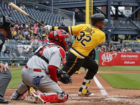 Pittsburgh Pirates' Elias Diaz (32) drives in two runs with a single off St. Louis Cardinals starting pitcher Luke Weaver in the sixth inning of a baseball game in Pittsburgh, Sunday, April 29, 2018.