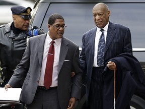 Bill Cosby, right, arrives for his sexual assault trial, Wednesday, April 11, 2018, at the Montgomery County Courthouse in Norristown, Pa.
