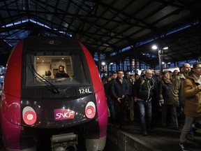 Commuters arrive at Saint-Lazare train station in Paris, Wednesday, April 4, 2018 in the first of a series of strikes that are set to last three months. A major French railway strike has brought the country's famed high-speed trains to a halt, leaving passengers stranded and posing the biggest test so far for President Emmanuel Macron's economic strategy.