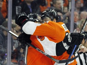 Philadelphia Flyers' Ivan Provorov, left, and Michael Raffl, right, celebrate Provorov's goal during the second period of an NHL hockey game against the Carolina Hurricanes, Thursday, April 5, 2018 in Philadelphia, PA.