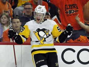 Pittsburgh Penguins' Jake Guentzel, celebrates his goal during the third period in Game 6 of an NHL first-round hockey playoff series Sunday, April 22, 2018, in Philadelphia.