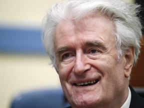 Former Bosnian Serb leader Radovan Karadzic arrives for the second day of his appeal at a U.N. court against his convictions on charges including genocide and crimes against humanity and his 40-year prison sentence in The Hague, Netherlands, Tuesday, April 24, 2018.