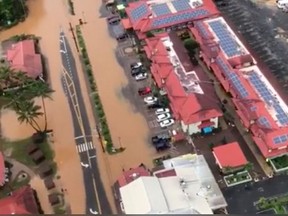 This image taken from video provided by the U.S. Coast guard shows flooding in Kauai's Hanalei Bay, Hawaii, Sunday, April 15, 2018. Hawaii Gov. David Ige issued an emergency proclamation for the island where heavy rainfall damaged or flooded dozens of homes in Hanalei, Wainiha, Haena and Anahola.