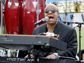 FILE--In this Nov. 6, 2016, file photo, musician Stevie Wonder performs at a campaign rally for Democratic presidential candidate Hillary Clinton before President Barack Obama spoke in Kissimmee, Fla. A Florida man was sentenced in Hawaii, Thursday, April 19, 2018, to spend two months behind bars and four months under home confinement for his role in scamming the University of Hawaii out of $200,000 for a Stevie Wonder concert that never happened.