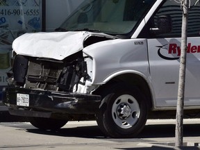 A van with a damaged front-end is shown on a sidewalk after a van mounted a sidewalk crashing into a number of pedestrians in Toronto on Monday, April 23, 2018. The van attack that left 10 people dead in Toronto this week has raised questions about what could be done to guard against similar incidents, with experts saying some new automotive technology and urban planning measures may help mitigate risk.
