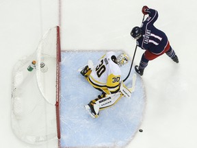 Pittsburgh Penguins goalie Matt Murray mkes a save against Columbus Blue Jackets' Matt Calvert on Thursday.