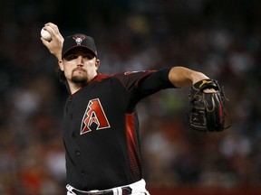 Arizona Diamondbacks starting pitcher Zack Godley throws to a San Diego Padres batter during the first inning of a baseball game Saturday, April 21, 2018, in Phoenix.