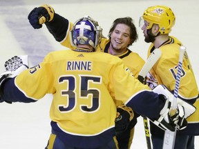 Nashville Predators' goaltender Pekka Rinne has a hug for the overtime hero Kevin Fiala following their dramatic 5-4 win over the Winnipeg Jets in double overtime during Game 2 action in their West Conference semifinal Sunday night in Nashville.