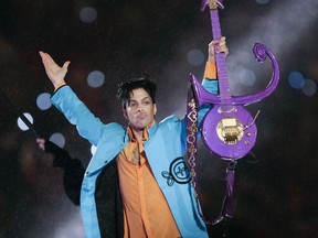 In this Feb. 4, 2007 file photo, Prince performs during halftime of the Super Bowl XLI football game in Miami.