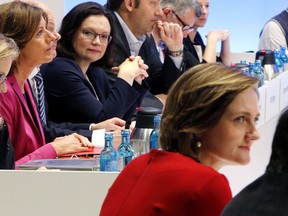 Candidates for SPD leadership Andrea Nahles, 2nd left, and Simone Lange sit in the plenum before the election during a party meeting of German Social Democrats in Wiesbaden, Germany, Sunday, April 22, 2018.