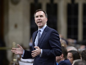 Minister of Finance Bill Morneau rises during Question Period in the House of Commons on Parliament Hill in Ottawa on Tuesday, April 24, 2018.