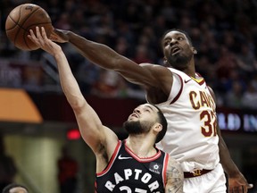 Cleveland Cavaliers forward Jeff Green (right) knocks the ball loose from Toronto Raptors guard Fred VanVleet on April 3.