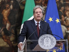 Italian Premier Paolo Gentiloni speaks during a press conference at Chigi Palace Premier office in Rome, Saturday, April 14, 2018. Gentiloni says air strikes by Italy's allies in Syria ''cannot and should not be the start of an escalation.'' Gentiloni said Saturday that Italy did not participate in the attacks, conducted by the United States, France and Britain. And he said that Italy made clear to its allies that none of the airstrikes could depart from Italian territory, where the United States has military bases.