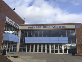 This April 1, 2018, photo shows Pioneer High School in Ann Arbor, Mich. A gun openly carried by a spectator at a school concert at Pioneer High School in 2015 has turned into a major legal case as the Michigan Supreme Court considers whether the state's public schools can trump the Legislature and adopt their own restrictions on firearms. Michigan's high court is set to hear arguments Wednesday, April 11.