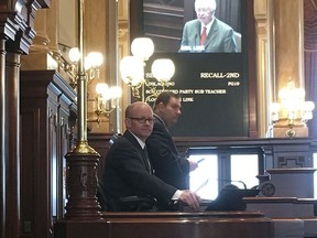 President Pro Tempore of the Senate Don Harmon, a Democrat from Oak Park, seated, presides over the Illinois Senate Wednesday, April 25, 2018, next to Senate Parliamentaran Giovanni Randazzo at Illinois State House in Springfield, Ill. Harmon is sponsor of legislation to require state licensing of firearms dealers, which was vetoed by Republican Gov. Bruce Rauner. Harmon said he had enough votes to override the veto, but some members wanted assurances by Wednesday's deadline that the House would vote to override, too, while some House members were waiting to see what the Senate did.