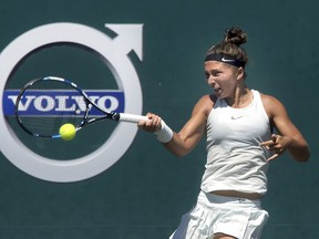 Sara Errani, of Italy, hits a forehand to Eugenie Bouchard, of Canada, at the Volvo Car Open tennis tournament in Charleston, S.C., Tuesday, April 3, 2018. Errani won 6-4, 6-4.
