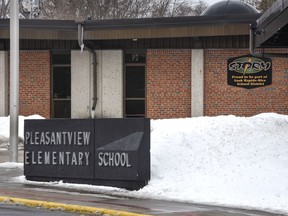 A sign marks one of the entrances to Pleasantview Elementary School on Monday, April 16, 2018, in Sauk Rapids, Minn. Authorities say an 8-year-old student took a kitchen knife to the central Minnesota elementary school and attacked three other children on Monday.