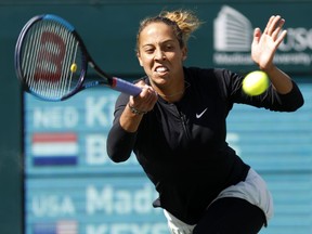 Madison Keys returns a shot to Kiki Bertens, from the Netherlands, during their semifinals match at the Volvo Car Open tennis tournament in Charleston, S.C., Sunday, April 8, 2018.
