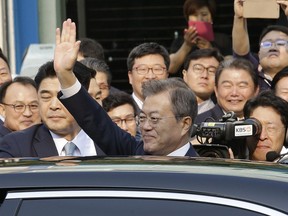 South Korean President Moon Jae-in waves as he leaves to meet with North Korean leader Kim Jong Un, near presidential Blue House in Seoul, South Korea, Friday, April 27, 2018. North Korean leader Kim Jong Un and President Moon are scheduled to hold much-anticipated face-to-face talks on the South Korean side of the Demilitarized Zone in Panmunjom, Friday.