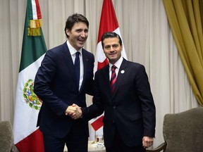 Prime Minister Justin Trudeau meets with Mexican President Enrique Pena Nieto in Lima, Peru on Friday, April 13, 2018.