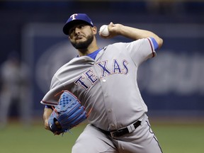 Texas Rangers starting pitcher Martin Perez delivers to the Tampa Bay Rays during the first inning of a baseball game Monday, April 16, 2018, in St. Petersburg, Fla.