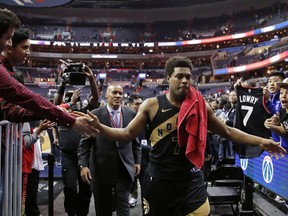 Toronto Raptors guard Kyle Lowry celebrates with fans as he leaves the court after Game 6 of the team’s NBA basketball first-round playoff series Washington Wizards, Friday, April 27, 2018, in Washington. The Raptors won 102-92 and took the series.