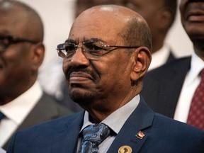 FILE - In this June 14, 2015 file photo, Sudanese President Omar al-Bashir smiles during a visit to Johannesburg, South Africa. Sudan's state news agency said Tuesday, April 10, 2018, that President Omar al-Bashir ordered the release of all political prisoners, effective immediately, as part of national dialogue efforts. The report carried by SUNA on Tuesday did not say how many individuals would be released, but said the move came in the spirit of "reconciliation, national harmony and peace."