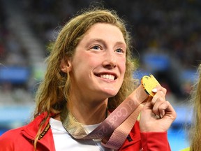 Canadian Taylor Ruck holds her women's 200-metre freestyle gold medal at the Commonwealth Games in Australia on April 5.